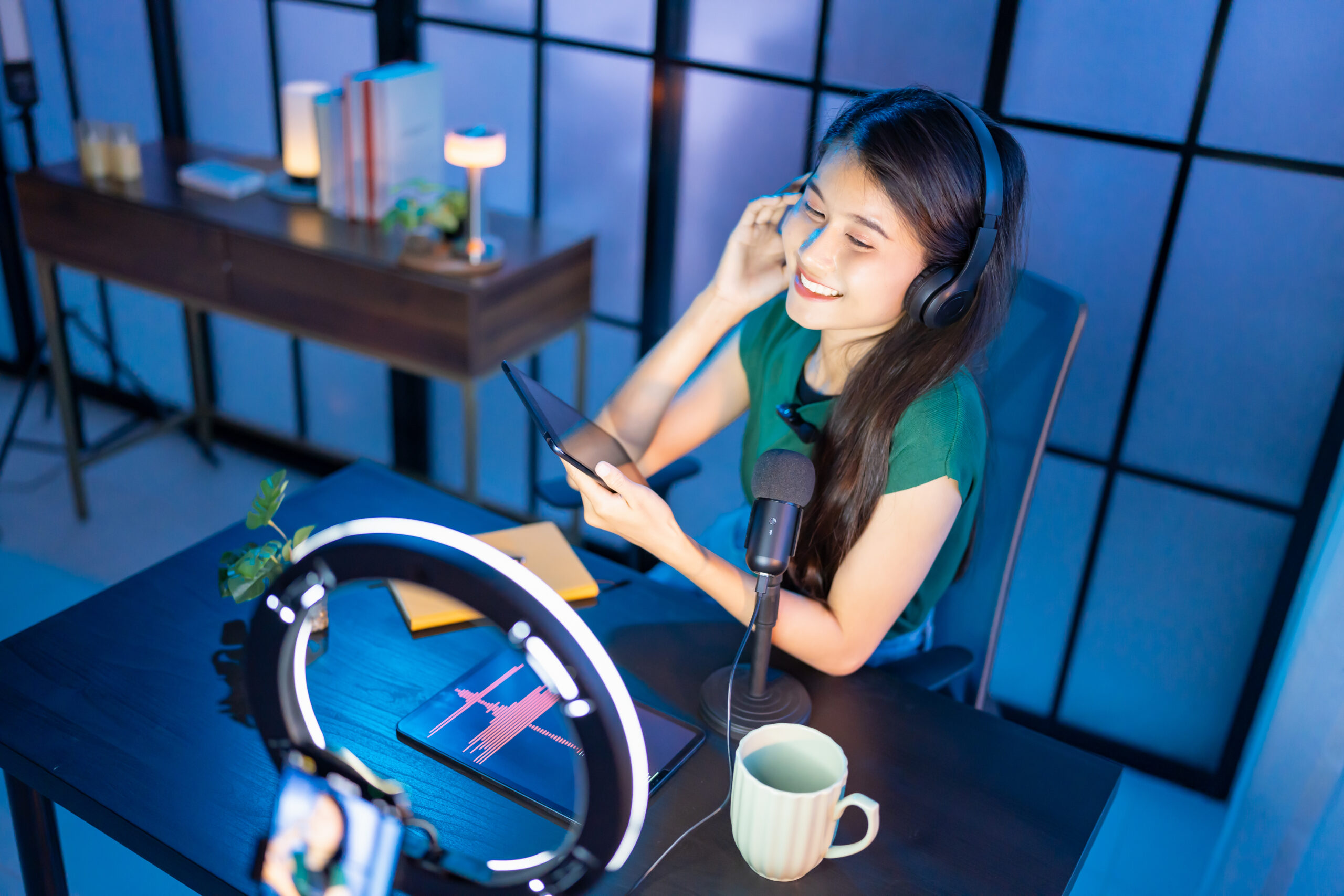 Content creator Young asian woman influencer creating content in home studio entertainment and communication blogger video record with smartphone for online vlog